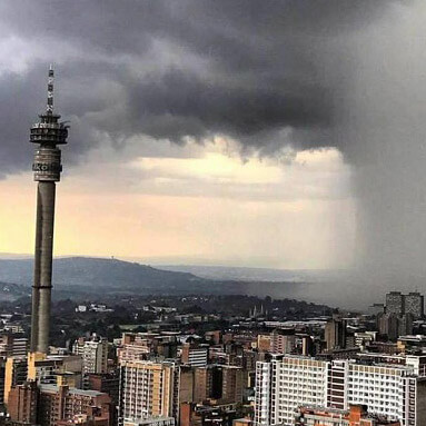 Heavy rain over Johannesburg skyscrapers