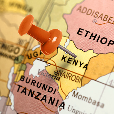 Map of Kenya with green drawing pin stuck to Kenya.